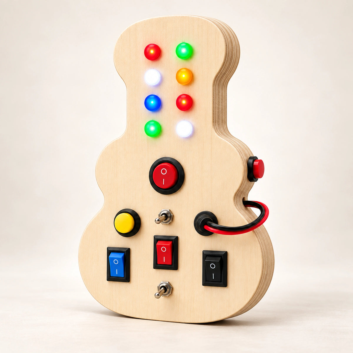 Angled view of RedMonkys Melody Explorer guitar-shaped wooden busy board showing layered birch wood construction
