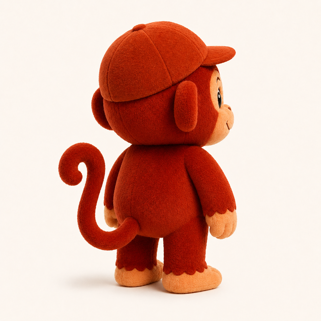 Back side view of RedMonkys RORO Soft Toy showing curled tail and soft cap